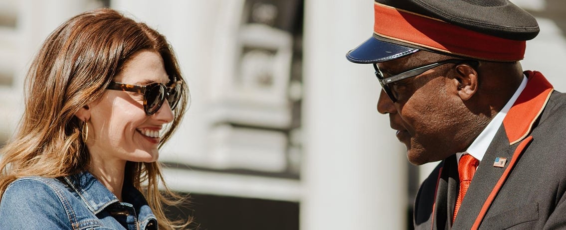 a couple speaking to the valet