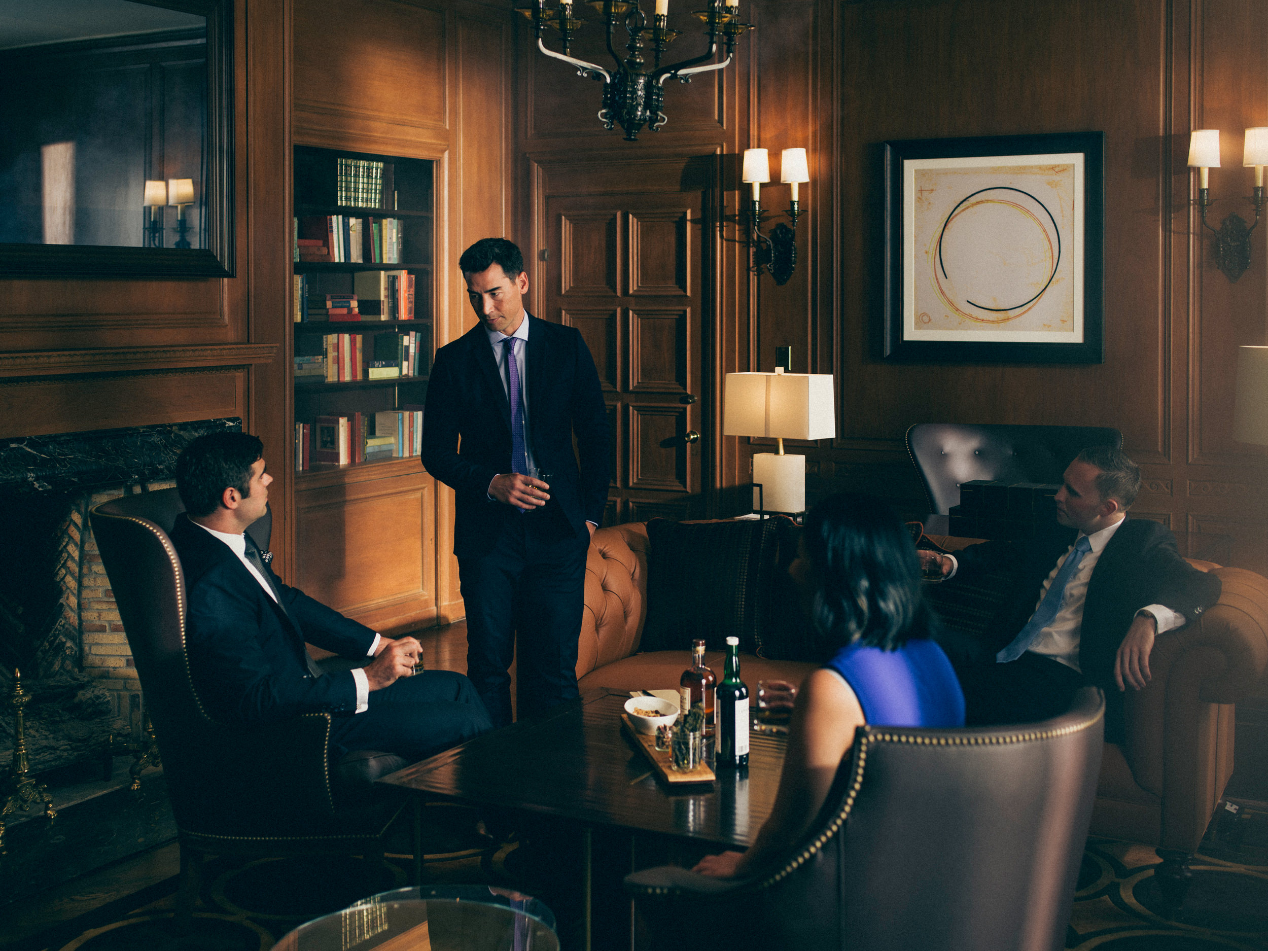 Three men and a woman were talking