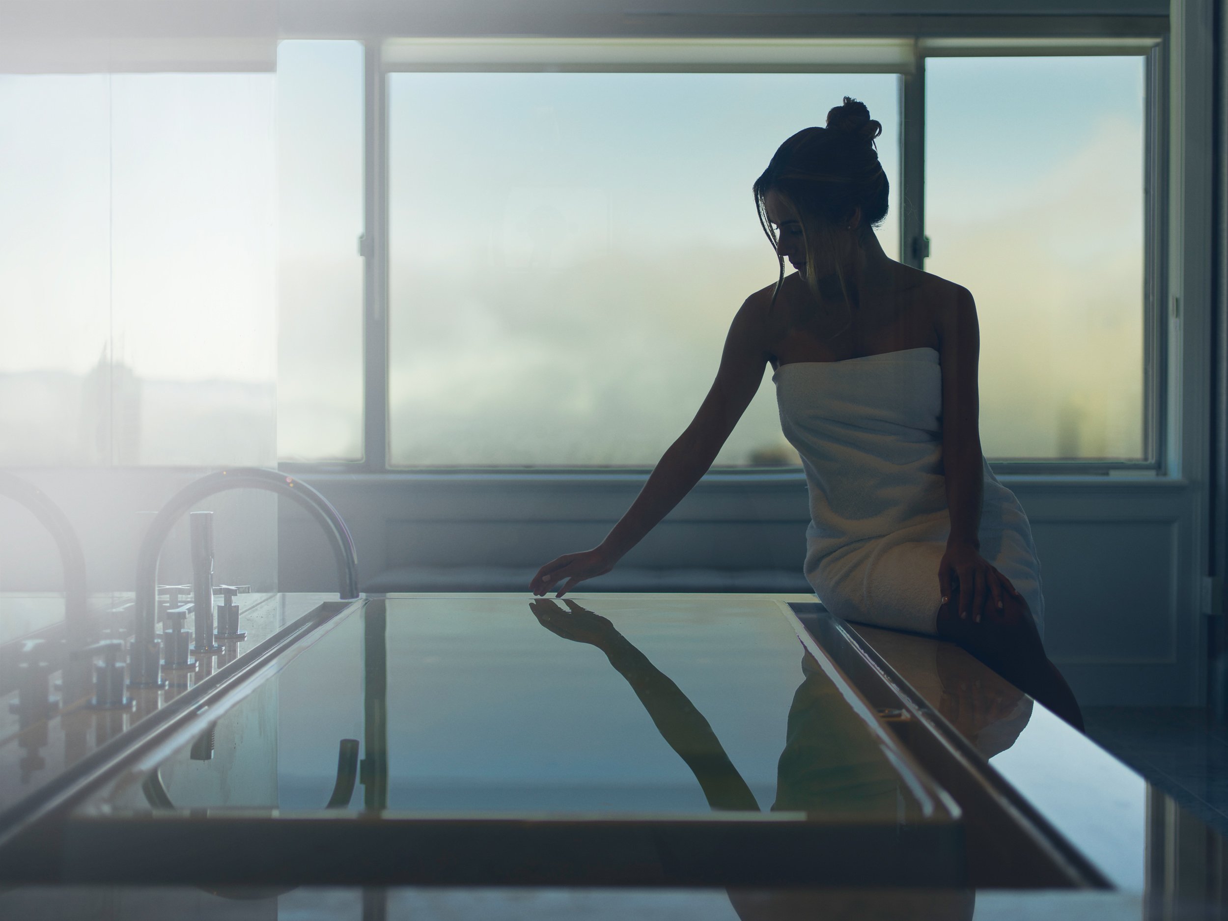 A woman about to take a bath