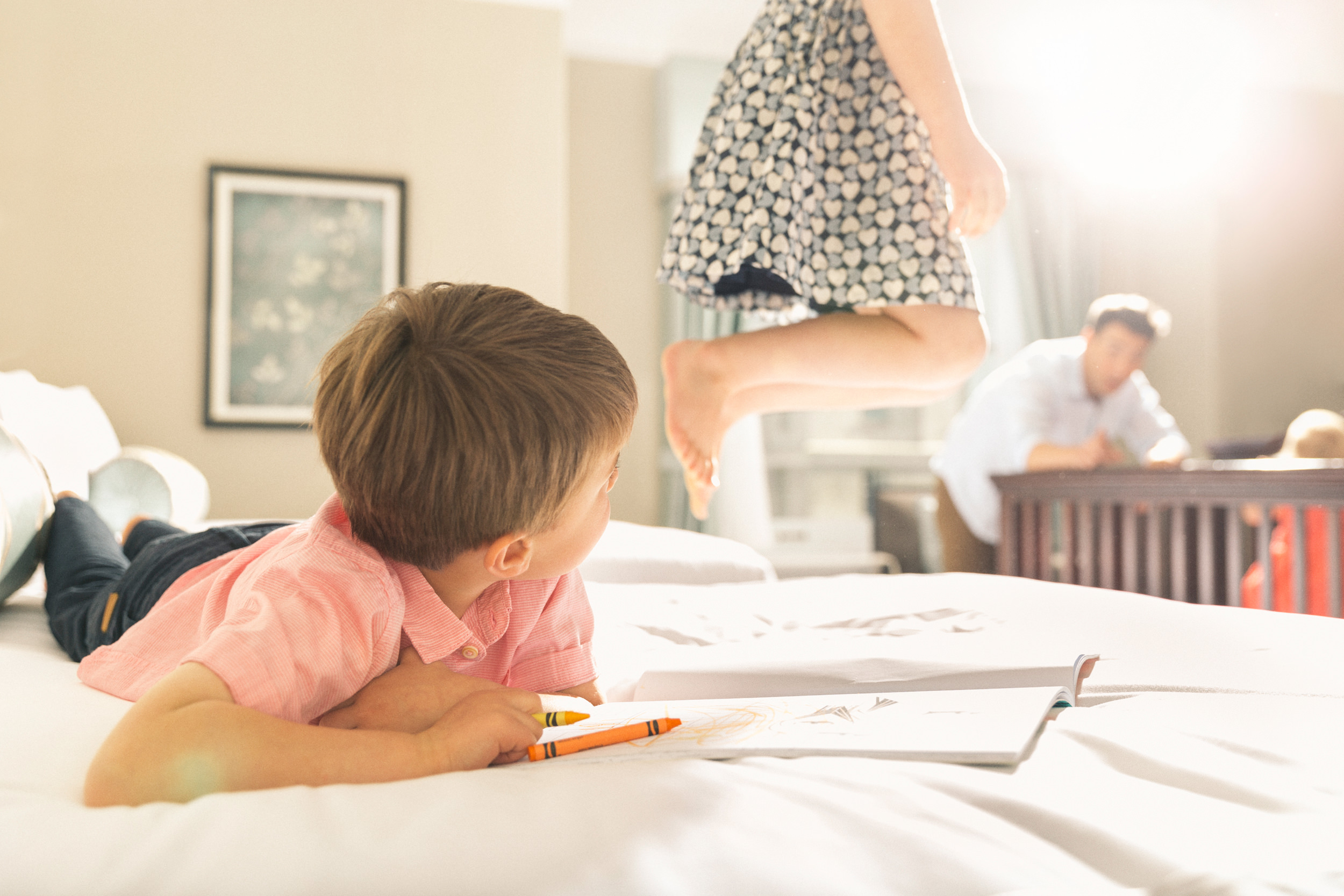 Children playing on the bed