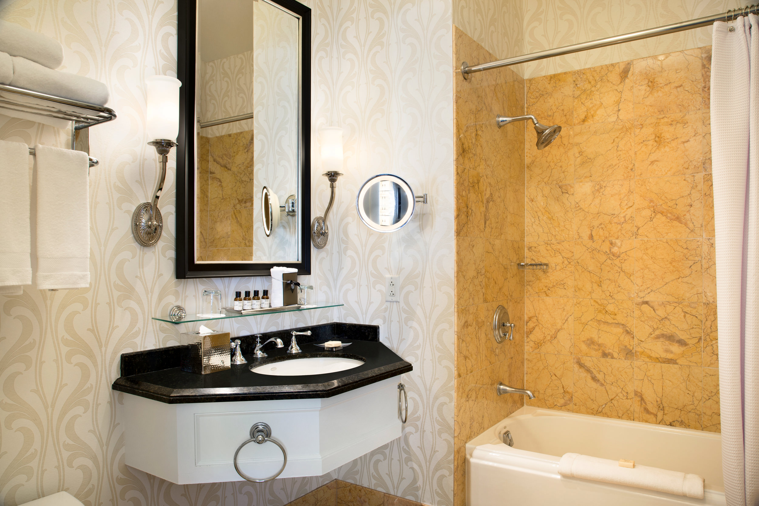 A bathroom with a black wash stand