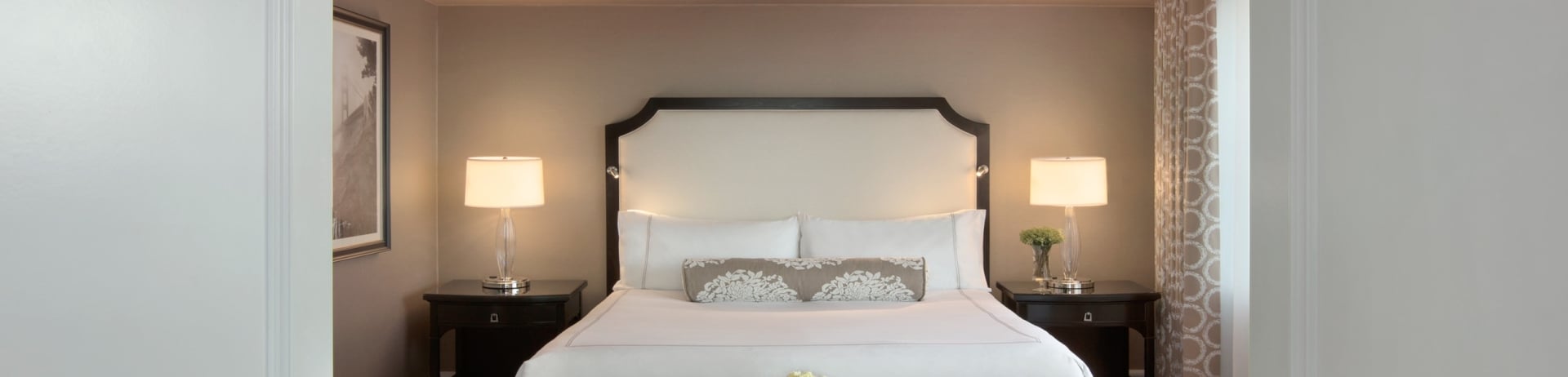 The light brown room has a bed