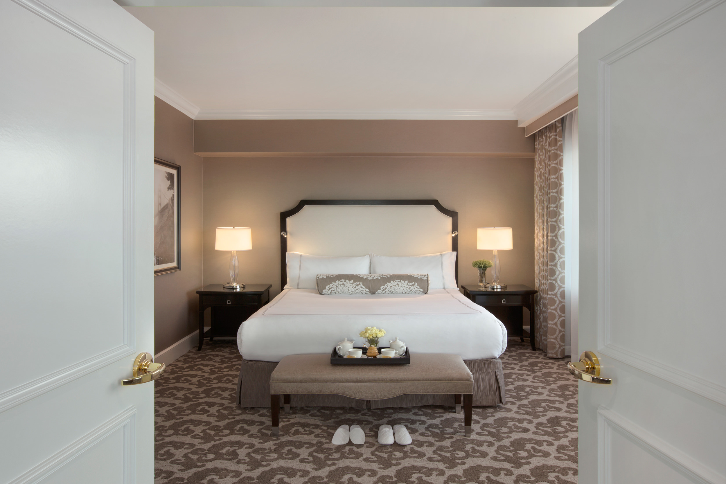 The light brown room has a bed