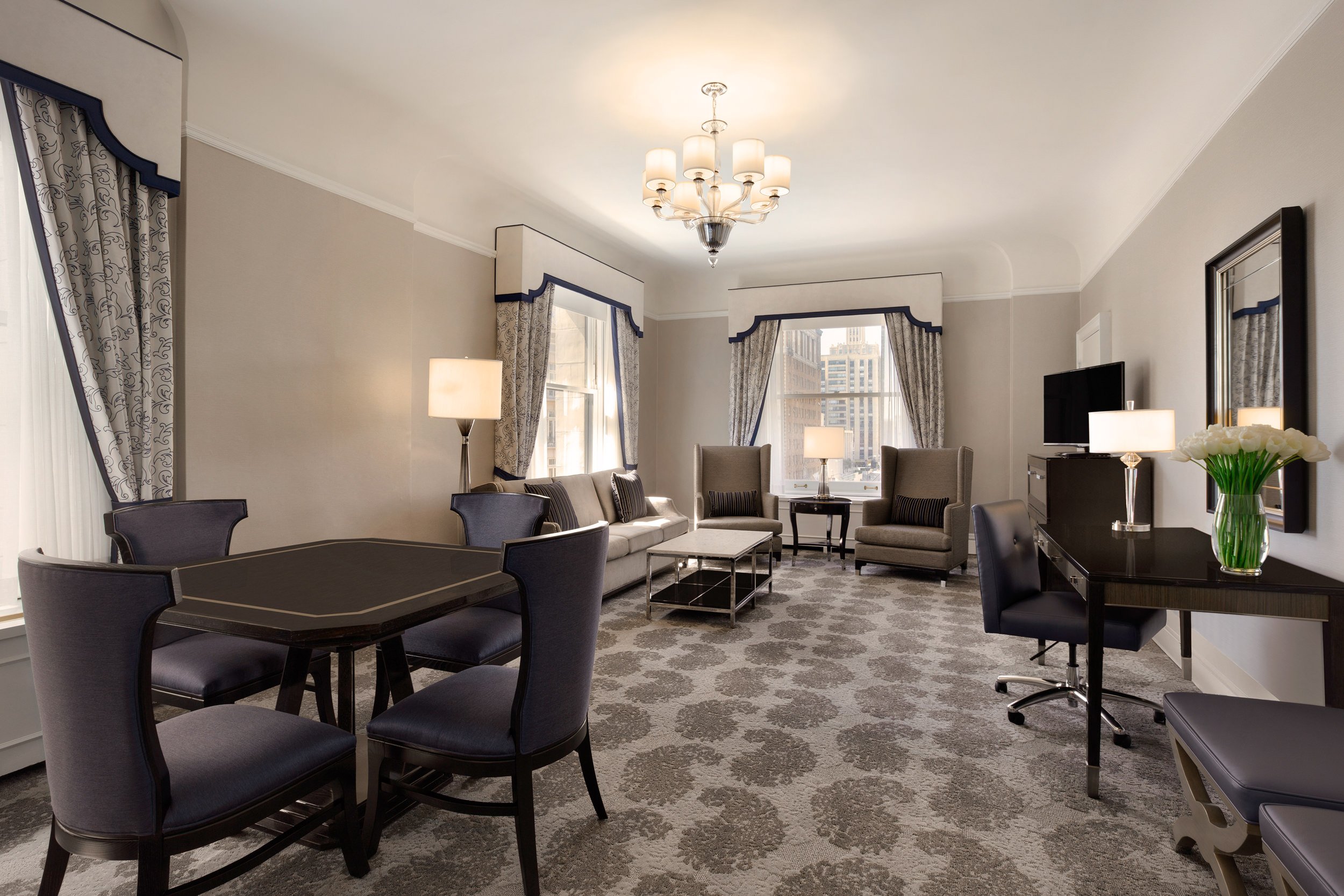 The living room has a dining table, sofa and coffee table