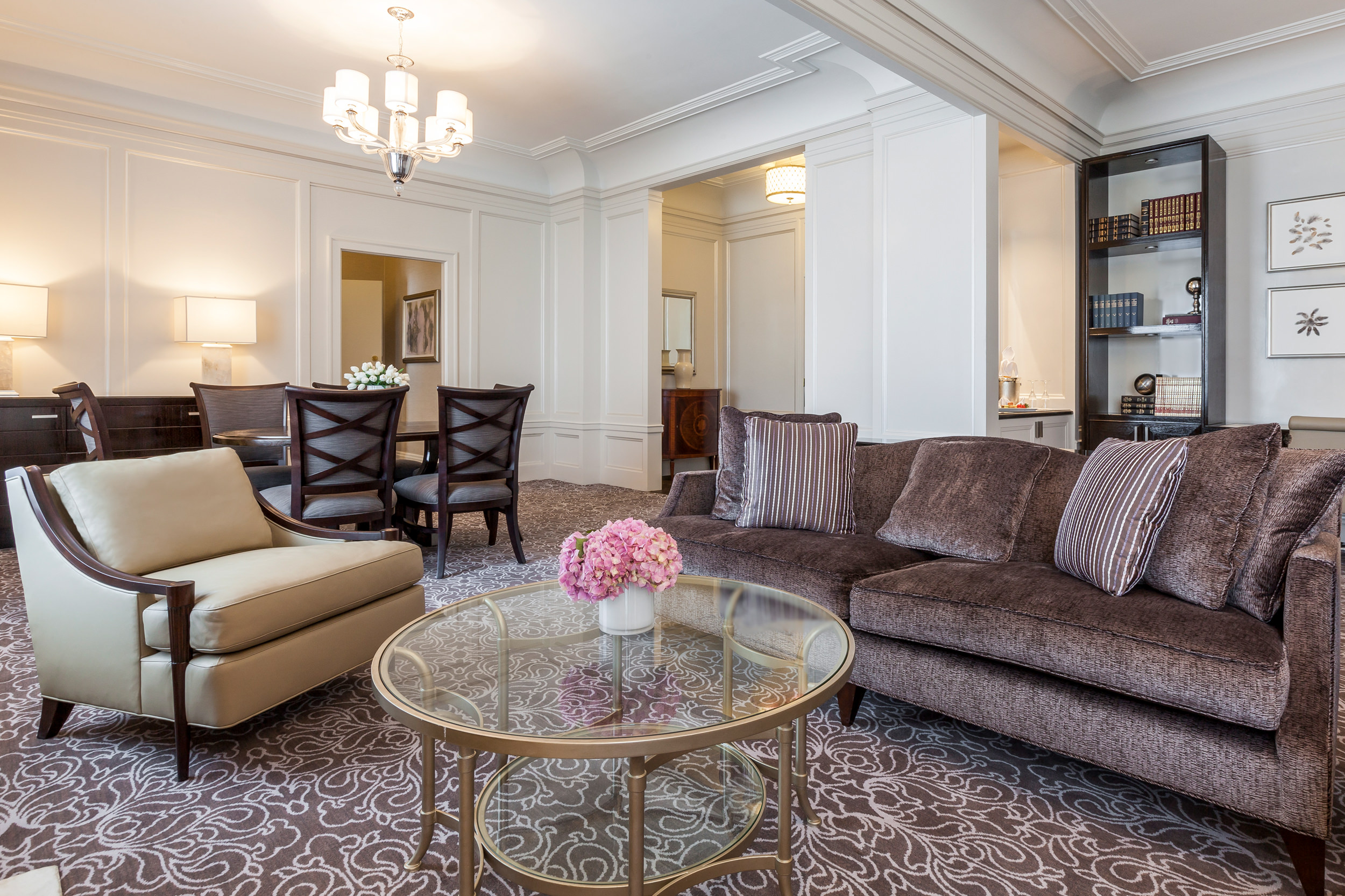 In the living room, there are modular sofas and round coffee tables