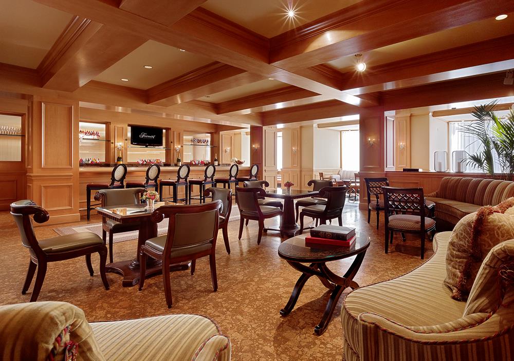 room with bar area and several seating options