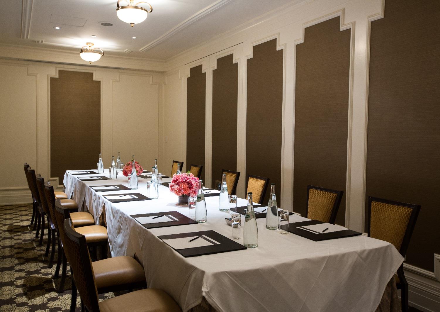 room with long table set up for a meeting