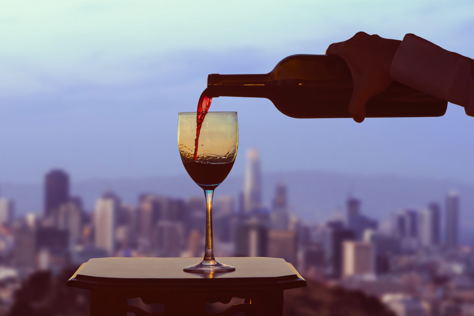 Pour red wine into a glass