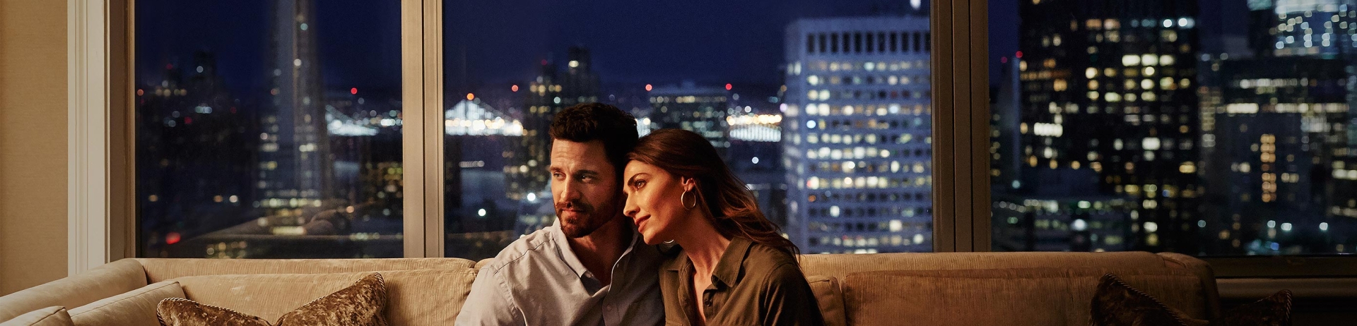 couple cuddling on a couch