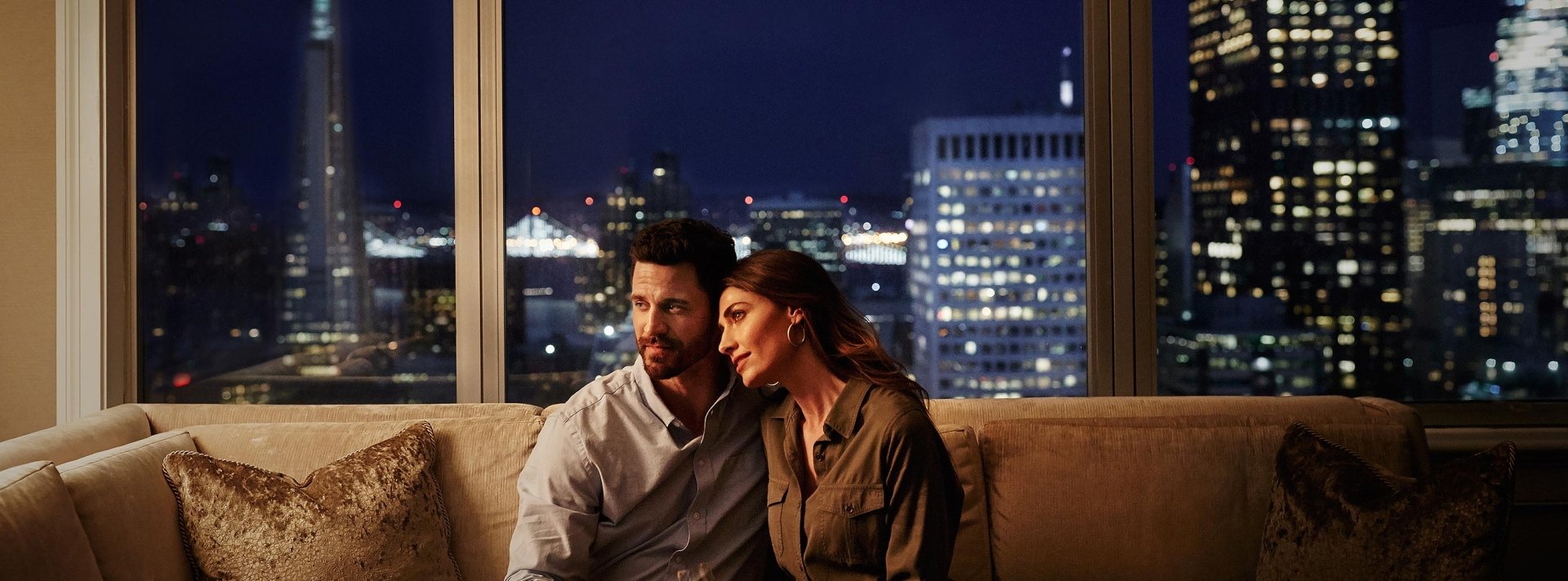 couple cuddling on a couch