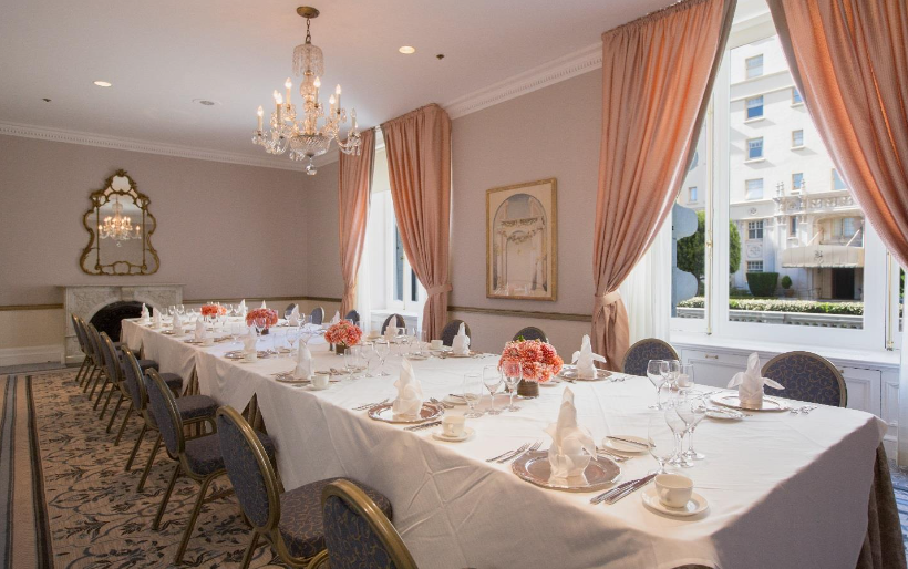 room with long table set up for a meeting