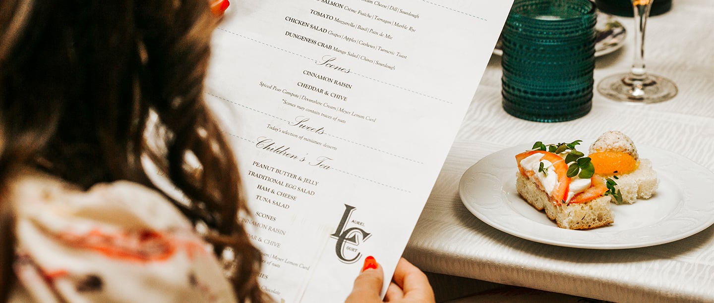 woman looking at menu