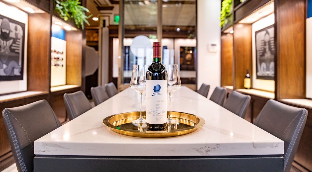 bottle of wine on gold serving platter